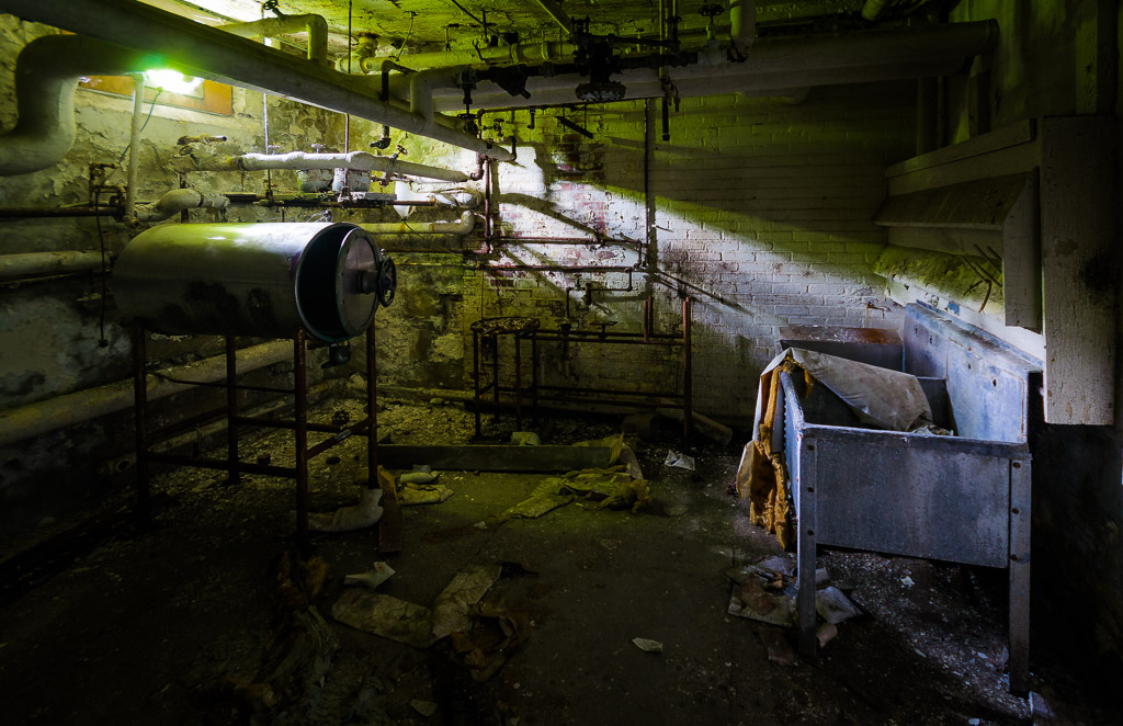 With apologies to Stephen King!  This laundry room in the basement of the medical building had vegetation filtering some of the light which rendered an eerie glow to an already eerie lighting.

From the Letchworth Village Institute for the Feeble Minded and Epileptic