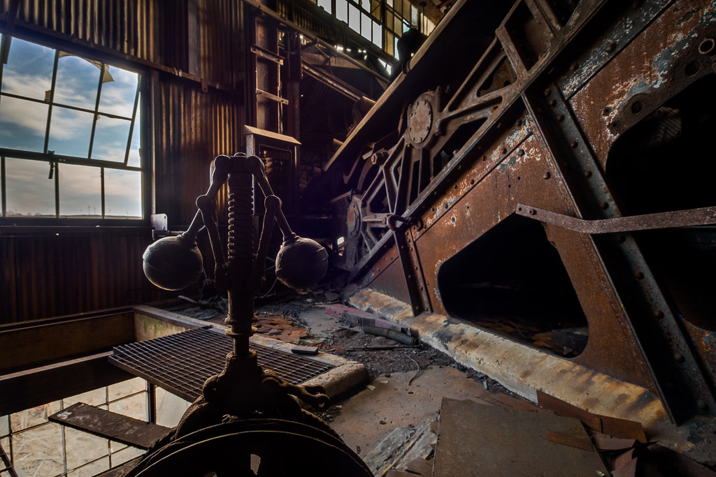 To the right is the top anchor of the bellt sysstem and motor drives which hauled the coal to the top of the building.

These are just a teaser from my first visit to an abandoned coal breaker in the western middle fields of central Pennsylvania's anthracite coal country.  I arrived there just before sun up and shot throught the early morning.

Taken with a Panasonic G5 (DMC-G5) and Olympus 9-18mm lens.

Please visit the <a href=