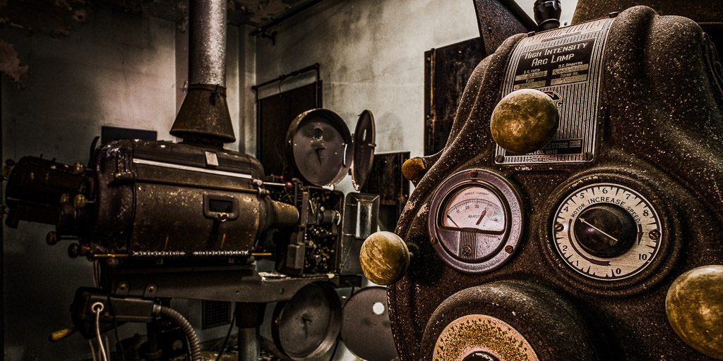 The old arc lamp driven movie projectors that are basically intact in the projection booth.

Made another trip to 