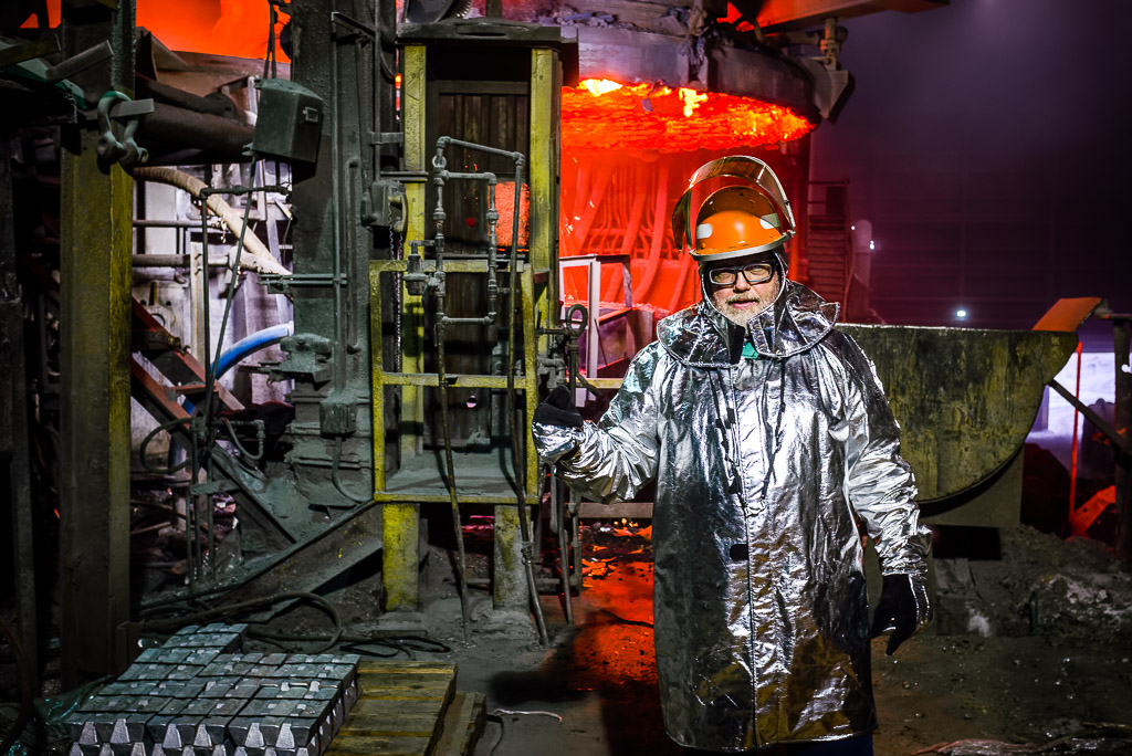 Me!  I'm wearing the same protection as the front line workers and very heavy gloves that made photography extremely difficult.

Today I did something I've never done: put on full hot metal zone gear and got in close and personal with the crew that handles hot metal.  The gear can be stifling even in this cooler weather and I am even more in awe of these guys now when I think of them doing this in the summer!

All pictures taken with an X100S wearing ridiculous aluminum and carbon fiber gloves.  It's amazing I got anything but the X100S is amazing with it's dials instead of buttons and tiny wheels.  Word.

Please like my Facebook Artists page: <a href=