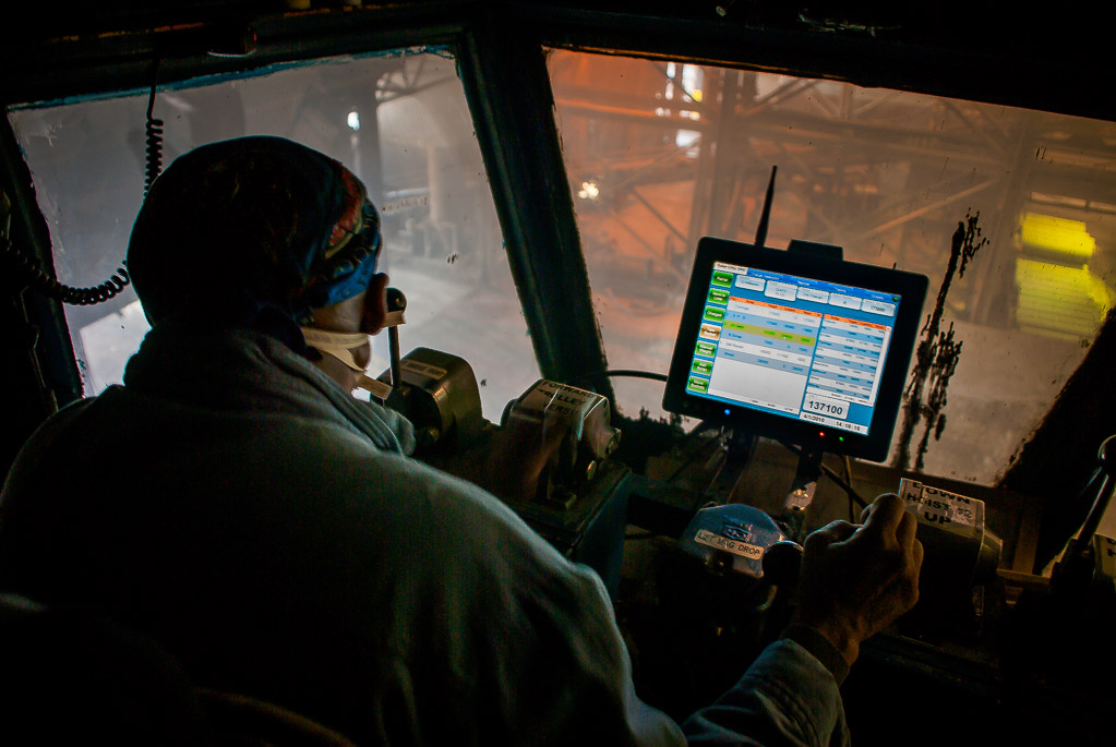 Up in the scrap crane -- and this is from some years ago so it's the old cramped cab.  The scrap crane operator loads the large clamshell buckets with a 