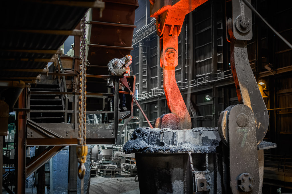 A workman puts special sand in the bottom of the ladle so the steel can't harden in the nozzle where it must flow out from when the gate is opened at the caster.

So, it's over.

The steel mill where I've worked for 22 years has closed the 