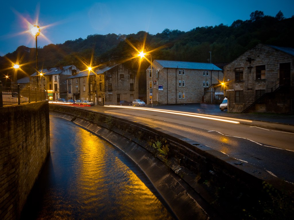 Todmorden is in the northern UK not far from Manchester.  It's a wonderful old town.

The northern UK is criscrossed by canals which were a major means of transportation throughout the region as increasing commercialization moved in.  The canals provided economical transport of goods in and out of the region.  Otherwise, it's a somewhat isolated series of valleys located in between highlands bordering either coast.

At one time the canal system fell into disrepair, but groups organized and have been restoring the system and you can rent the boats for events, parties or vacations, etc.  They are quite deep and roomy inside.